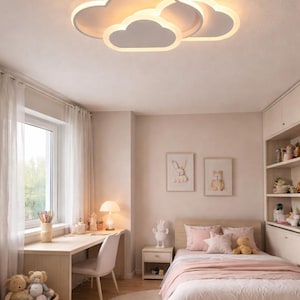 May include: A child's bedroom with a cloud-shaped ceiling light. The room features a desk, bed, and a round rug. The color scheme is soft pink and white, creating a cozy and inviting atmosphere. Decorative elements include framed artwork and stuffed animals.