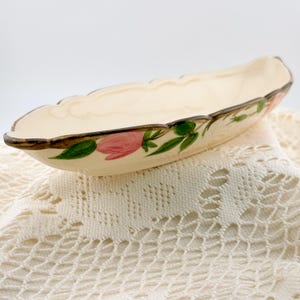 May include: A rustic wooden sign with the text "Welcome to our home" in a handwritten style. The sign features a distressed finish, with visible wood grain and a simple, inviting design. It's likely intended for indoor or outdoor home decor.