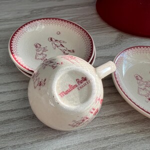 May include: A set of three ceramic mugs with a speckled, matte finish. The mugs are in shades of cream, light gray, and dark gray. Each mug has a simple, minimalist design, perfect for coffee or tea.