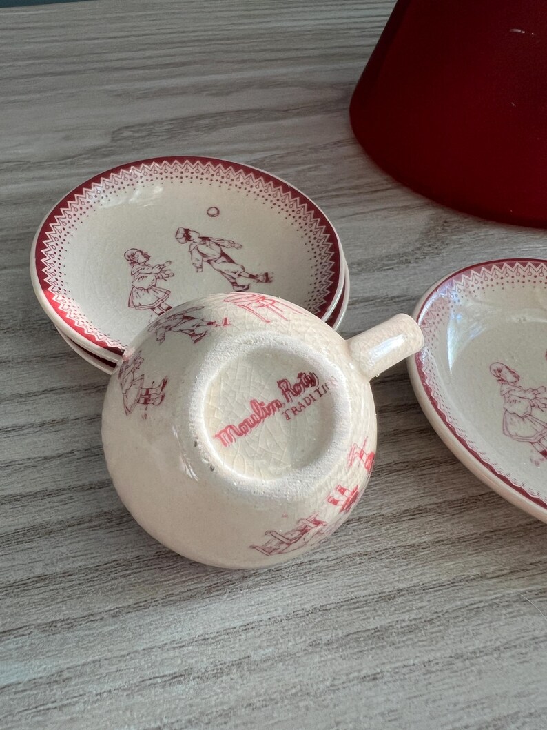 May include: A set of three ceramic mugs with a speckled, matte finish. The mugs are in shades of cream, light gray, and dark gray. Each mug has a simple, minimalist design, perfect for coffee or tea.