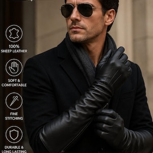 Puede incluir: Guantes de cuero negro con costuras finas, que se extienden hasta el antebrazo. Los guantes están hechos de 100% piel de oveja y se describen como suaves, cómodos, duraderos y duraderos. Los guantes se usan con un abrigo y una bufanda negros.