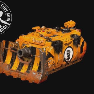 May include: A detailed miniature model of a yellow and black tank with a large blade at the front. The model has a weathered appearance, with rust-colored accents. The text "YOUR NEXT COOL MINI" is in a circle in the upper left corner.