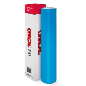 May include: A roll of bright blue vinyl next to a white box with red accents. The box is labeled "ORACAL 651" and "12" inches. The word "VINYL" is printed at the bottom of the box. The vinyl roll is approximately 30 cm wide.