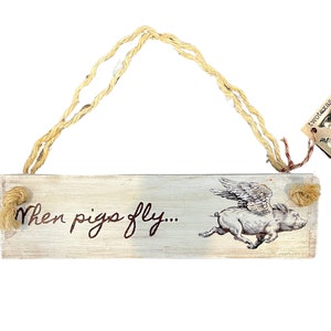 Hanging Sign With "When Pigs Fly..." Text