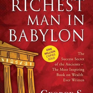 May include: Book cover for "The Richest Man in Babylon" by George S. Clason. The title is in large white letters against a red background. A yellow circle states "One Million Copies Sold". A gold illustration of a building is in the lower left.