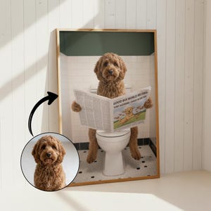 May include: A framed print features a brown Goldendoodle dog sitting on a toilet, reading a newspaper with the headline "Good Boi World Record." The dog is the focal point, set against a bathroom backdrop with a white toilet and black and white tiled floor.