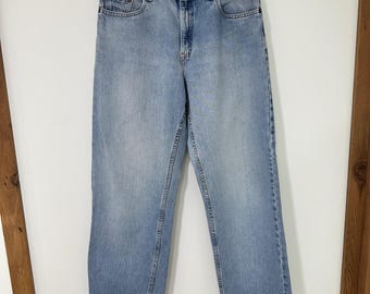 Calça jeans Levi's 577 de cintura baixa, modelagem solta, feminina, tamanho 12, lavagem clara, fabricada nos EUA | Vintage
