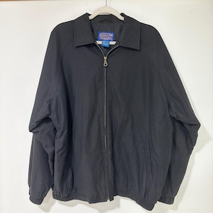 May include: A black zip-up jacket with a classic collar, long sleeves, and elasticized cuffs and hem. The jacket features a full-length front zipper with a metal pull and a Pendleton brand label sewn into the inner neckline area.