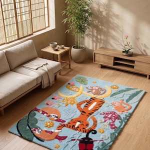 May include: A rectangular, light blue rug with a playful jungle theme. The rug features a large orange tiger, monkeys, sloths, and other jungle elements. The design is colorful and whimsical, perfect for a child's room or playroom.