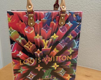 Upcycled authentic LV packaging shopping bag enclosed in  PVC.