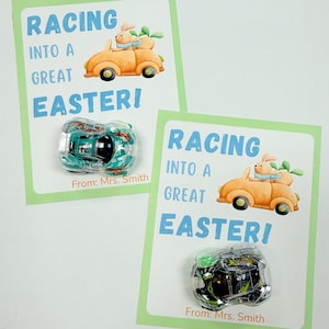 May include: Two Easter-themed cards with the text "RACING INTO A GREAT EASTER!" and a cartoon car with a bunny driver. Each card has a small toy car attached. The text "From: Mrs. Smith" is printed at the bottom of each card.