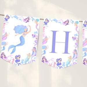 Welcome your guests in style with this beautiful mermaid happy birthday banner, perfect for any under the sea birthday shellebration. Featuring delicate, scattered little mermaids and sea creatures in a soft colour template, this design is soft, playful and perfect for a splish splash shellebration or under the sea themed party. Designed to match our mermaid birthday invitation, welcome sign and cupcake toppers.