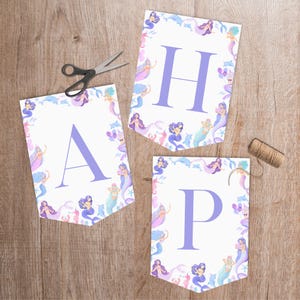 Welcome your guests in style with this beautiful mermaid happy birthday banner, perfect for any under the sea birthday shellebration. Featuring delicate, scattered little mermaids and sea creatures in a soft colour template, this design is soft, playful and perfect for a splish splash shellebration or under the sea themed party. Designed to match our mermaid birthday invitation, welcome sign and cupcake toppers.