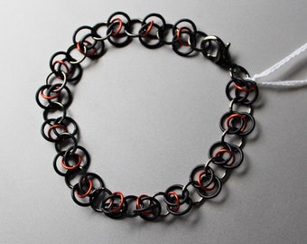 Chainmaille Bracelet:  Orbital Weave Chain in Black and Red-Orange