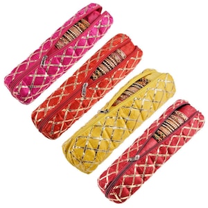 May include: Four colorful, quilted bangle storage cases in pink, red, yellow, and maroon. Each case has a zipper closure and gold-colored diamond pattern. The cases are filled with various bangles.