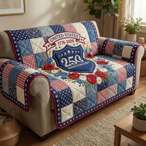 May include: A patchwork sofa cover in red, white, and blue, with embroidered floral details. The cover displays the text "UNITED STATES 1776-2026 250 ANNIVERSARY" on a shield, suitable for a sofa.