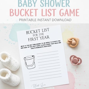 May include: A baby shower bucket list game printable with the text "Baby Shower Bucket List Game". The game includes a bucket list for the first year, a wooden teether, a pink dummy, and white baby booties.