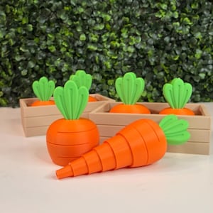 May include: A set of three ceramic mugs with a speckled, matte finish. The mugs are in shades of cream, light gray, and dark gray. Each mug has a simple, minimalist design and a rounded handle. The mugs are likely for coffee or tea.