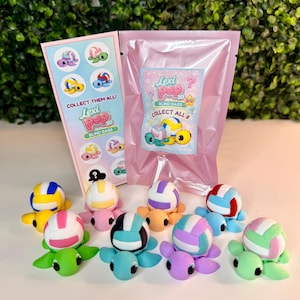 May include: A collection of colorful Lexi Pop 3D blind bag toys, each featuring a turtle with a volleyball design. The image includes a pink bag and a card with the text "COLLECT THEM ALL!" and "COLLECT ALL 8".