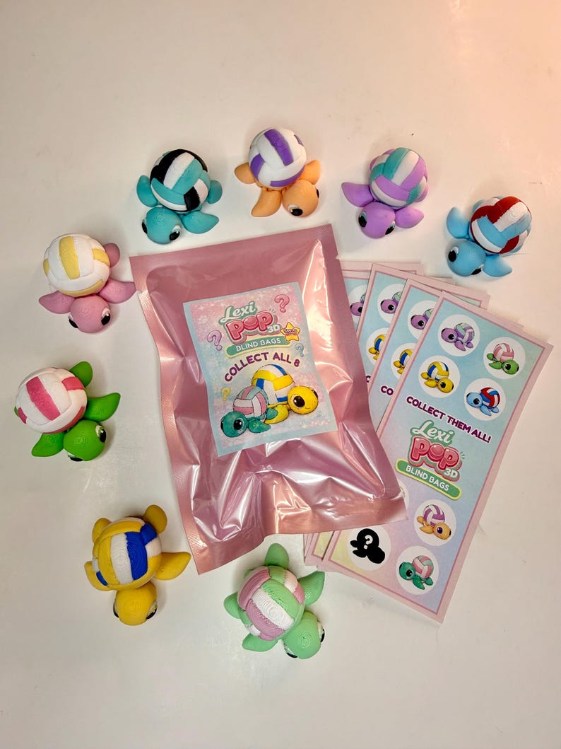 May include: A collection of colorful turtle figurines with volleyball-like shells, along with blind bags and collectible cards. The text on the packaging reads "Lexi Pop 3D Blind Bags" and "Collect Them All!"