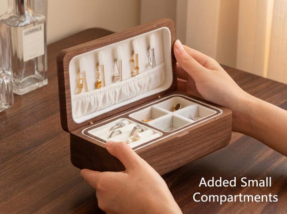 Black walnut and cherry wood joinery in a travel jewelry case — the two-tone hardwood contrast alone makes this look like fine furniture, not a box.