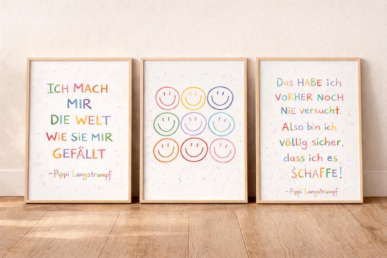 May include: Three framed art prints with German quotes and smiley face designs. The prints have light brown frames and white backgrounds. The text is in various colours. The quotes are attributed to Pippi Longstocking.