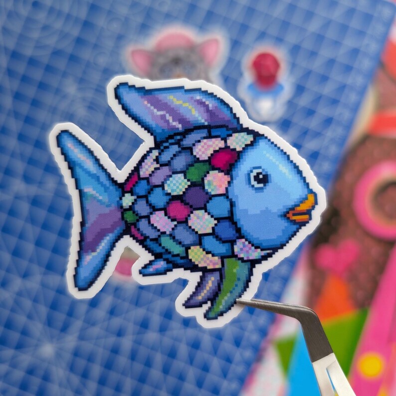 May include: A pixel art sticker of a fish with a light blue head and orange lips. The body is covered in a mosaic of multicolored scales in shades of blue, purple, pink, and green. The fins are a mix of blue and purple tones with a white border.