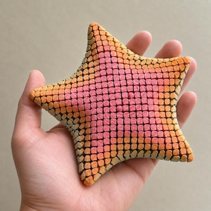 Giocattolo antistress a forma di stella marina, flessibile e articolato, stampato in 3D.