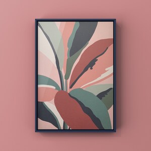 May include: Abstract art print featuring a stylized floral design with pink, red, green, and white leaves. The print is framed in a dark blue frame.