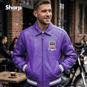 May include: A purple leather jacket with a white and black striped trim on the cuffs and hem. The jacket has a zipper closure and a patch on the chest with an American flag design. The jacket is from Sharp Leather Wear.