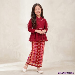 May include: A deep red long-sleeved lace peplum top with a beaded neckline and a matching long skirt featuring a vibrant, multi-colored geometric and floral pattern. The outfit is paired with simple white flat shoes. The text CHANIFAGifts is visible.