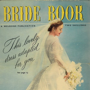 May include: A vintage magazine cover featuring a bride in a white lace wedding dress holding a bouquet of white flowers. The cover text reads "Bride Book, A Weldons Publication, Two Shillings, This lovely dress adapted for you, See page 13, Fashion * Beauty * Etiquette * Reception * Cookery".