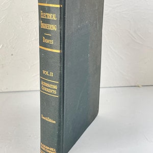 May include: A green hardcover book titled "Electrical Engineering" by Dawes, Volume II, Alternating Currents, Fourth Edition, published by McGraw-Hill Book Company.