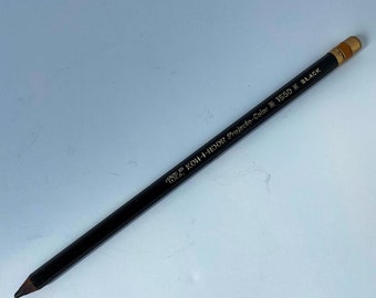 May include: A black Koh-I-Noor Projecto-Color 150% Black pencil with a gold-colored label.