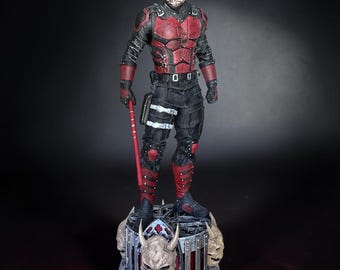 Daredevil character film - series, red and black suit with a red and black baton