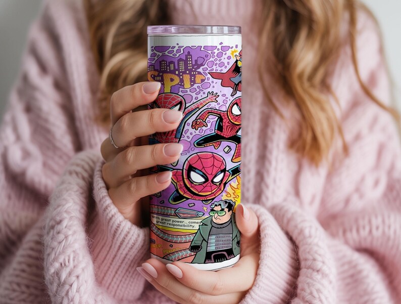 May include: A tall, cylindrical tumbler with a comic book design featuring Spider-Man illustrations. The tumbler has a purple background with a city skyline and text that reads "SP!" and "with great power... comes great responsibility."