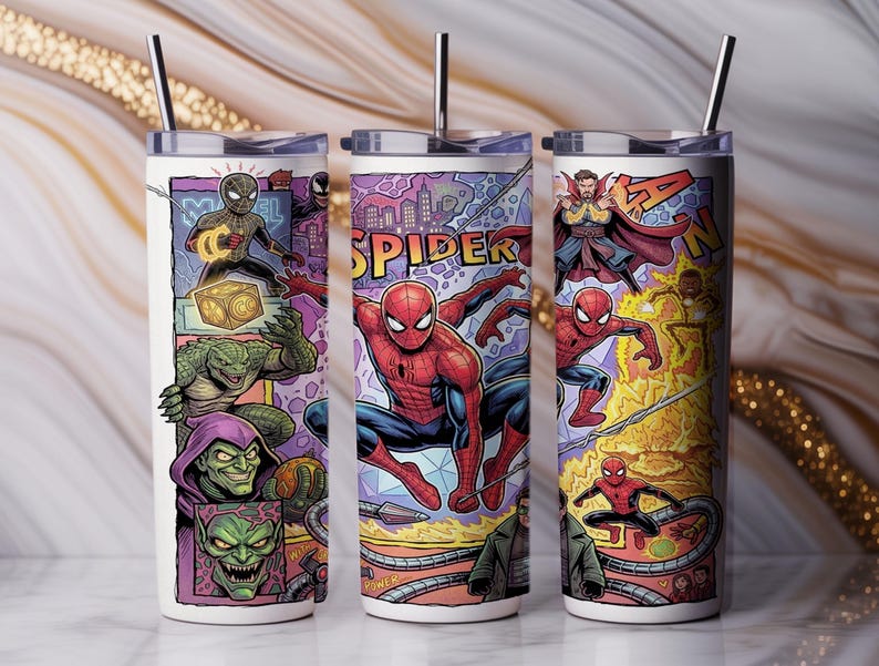 May include: Three cylindrical tumblers with lids and metal straws, featuring a colorful comic book graphic print. The design displays various characters including Spider-Man, Doctor Strange, Green Goblin, and Lizard, with the text SPIDER and MARVEL.