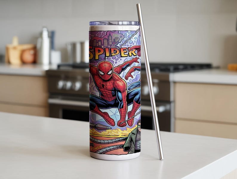 May include: A cylindrical stainless steel tumbler featuring a vibrant comic book graphic of Spider-Man in a red and blue suit, with the text SPIDER visible at the top. The tumbler includes a clear lid and a long, slender silver metal straw.