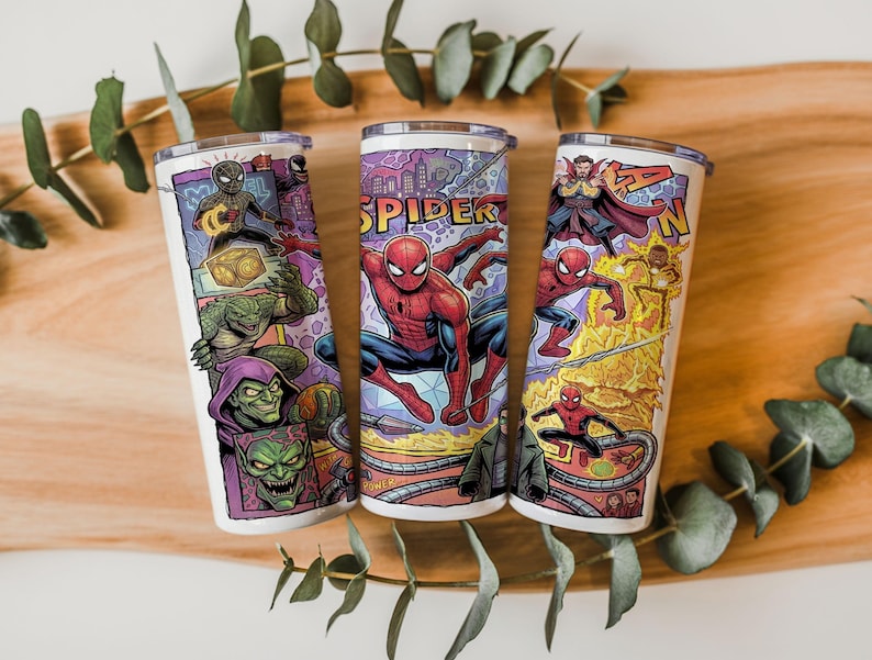 May include: Three cylindrical tumblers featuring a colorful comic book style graphic print of Spider-Man and various villains. The designs include illustrations of Spider-Man, Green Goblin, Doctor Strange, and other characters with the text SPIDER.