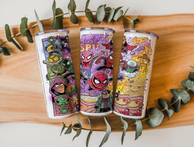 May include: Three stainless steel tumblers with vibrant comic book illustrations. The designs showcase Spider-Man and villains in action. The tumblers have white backgrounds and silver lids, ideal for drinks.