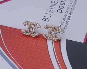 Women's diamond-encrusted letter earrings, a birthday gift for her, packaged in a gift box.