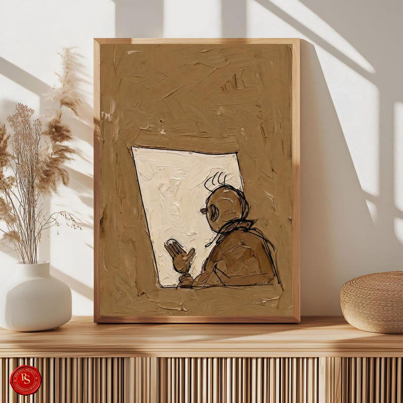 May include: A framed abstract art print featuring a figure reading a document. The artwork uses a palette of brown and cream tones, with a textured, painterly style. The figure is depicted in a simple, sketched style, adding a touch of whimsy to the piece.