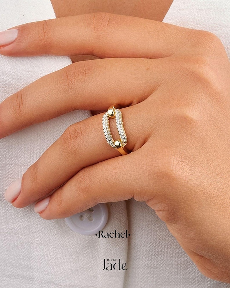 May include: A trio of ceramic mugs with a speckled, matte finish in cream, light grey, and dark grey. Each mug features a simple, minimalist design, ideal for tea or coffee.