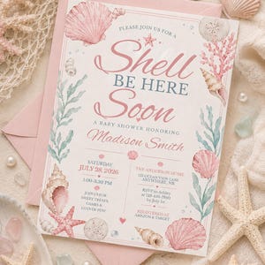 May include: A baby shower invitation with a seashell theme. The invitation features the text "Shell Be Here Soon" in pink script, surrounded by watercolor illustrations of seashells, starfish, and coral. The invitation includes event details and is set against a backdrop of sand and seashells.