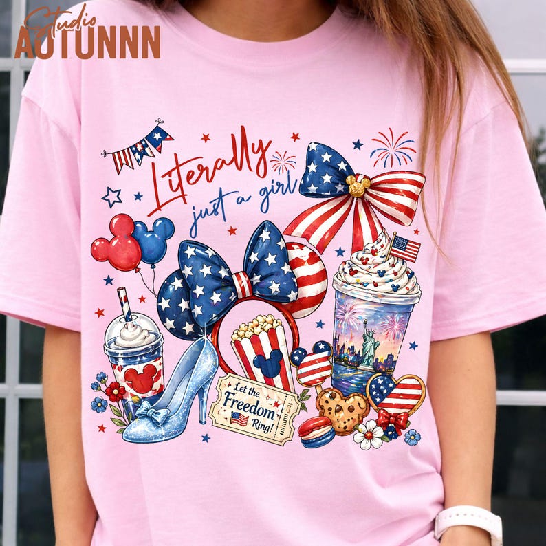 May include: Pink t-shirt with a patriotic design featuring a bow, high heel, and various American-themed graphics. The text "Literally just a girl" is displayed in red script. Includes Mickey Mouse balloons and popcorn.