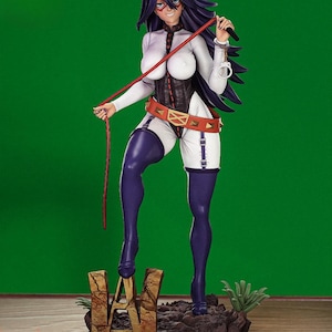May include: A figurine of a character with long purple hair, wearing a white bodysuit with a black corset, a red belt, and purple thigh-high boots. The figure is holding a whip and handcuffs. The base features the letters "HA" in gold.