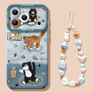 May include: A blue phone case with a cat-themed design, featuring illustrations of cats, fish, and stars. The case has a camera protector and the words "GOOD LUCK" printed on it. A beaded phone charm with various shapes and colors is also included.