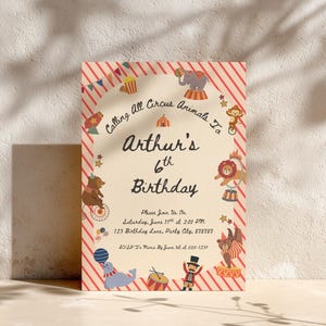 May include: A birthday invitation with a circus theme, featuring red and cream striped borders. The design includes illustrations of circus animals like an elephant, monkey, lion, bear, and seal. The text announces "Arthur's 6th Birthday".
