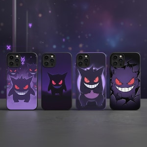 May include: Four black phone cases with purple Gengar designs. Each case features a different illustration of the Pokémon character with red eyes and a sinister grin. The cases are displayed against a dark purple background.