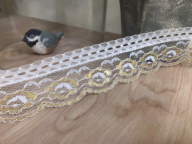 white flat laces with gold tips